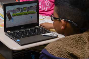student using chromebook